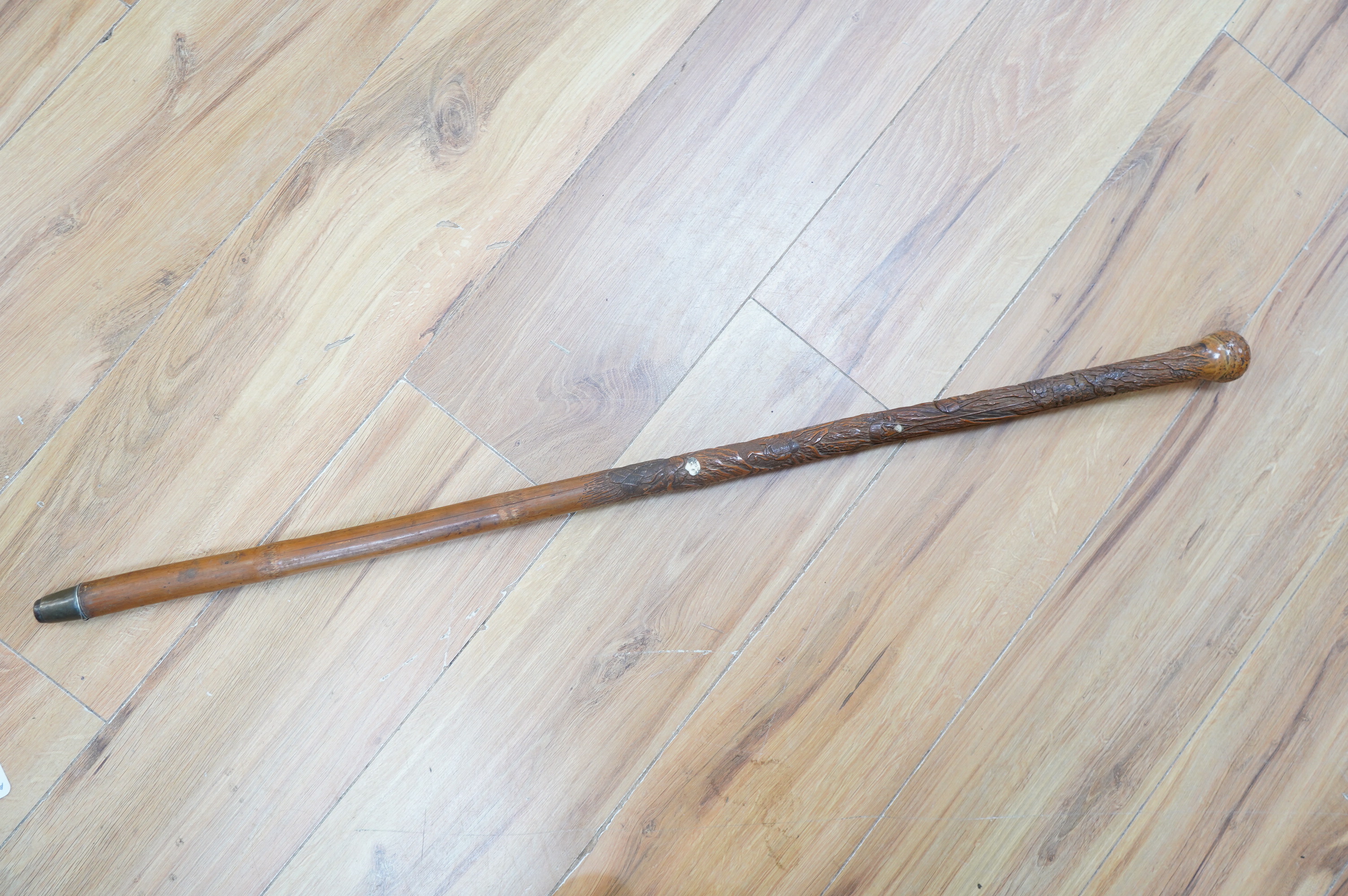 A Japanese carved bamboo walking cane with mother of pearl and ivory inlay. 89.5cm long. CITES Submission reference Submission reference 3UEQCLUL. Condition - fair